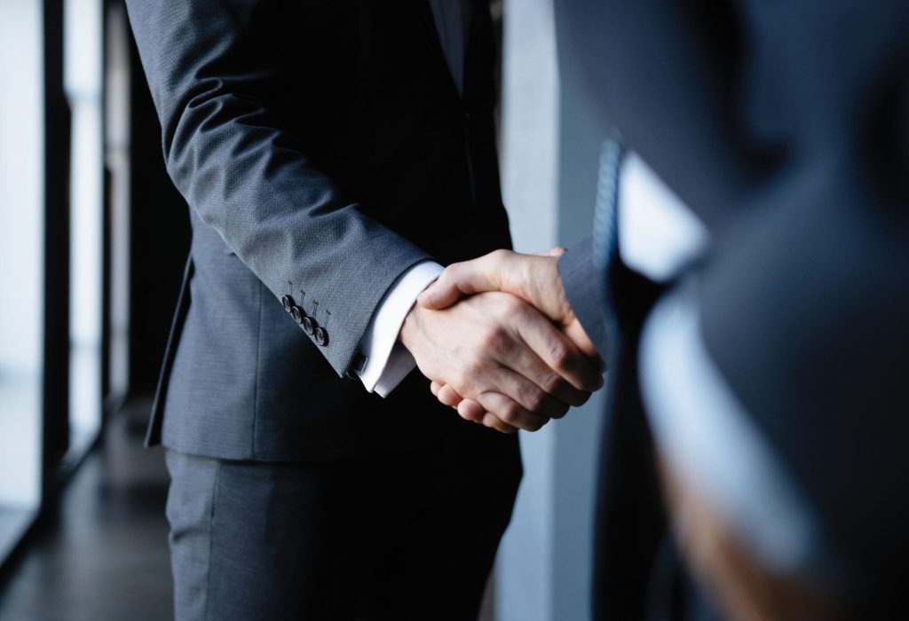 Business people shaking hands, finishing up a meeting